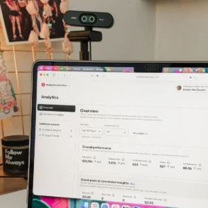 Laptop on a desk showing Pinterest analytics for a book blog